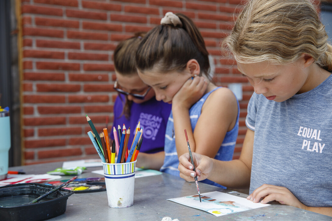 Campers work on art projects.