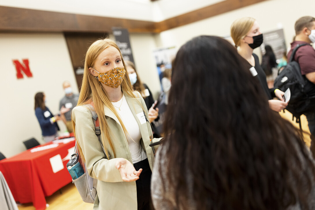 Jayme Soderbeck, a junior in management, talks with recruiters at the Career Fair Sept. 21.