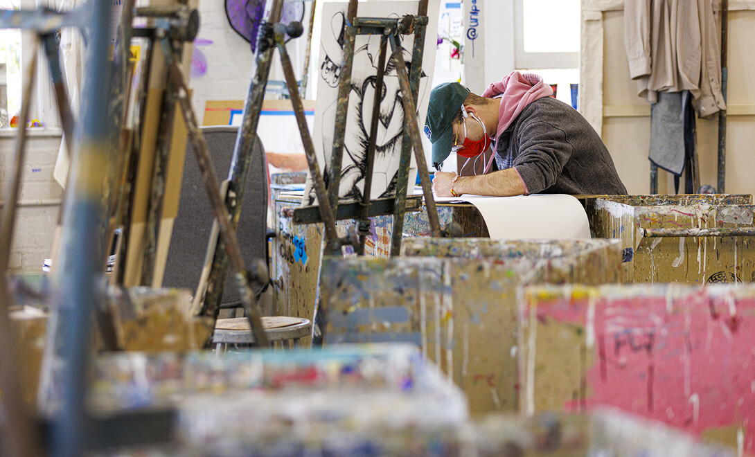 Javier Rivera, a senior from Omaha, works on an intermediate painting project in Richards Hall on Dec. 1.