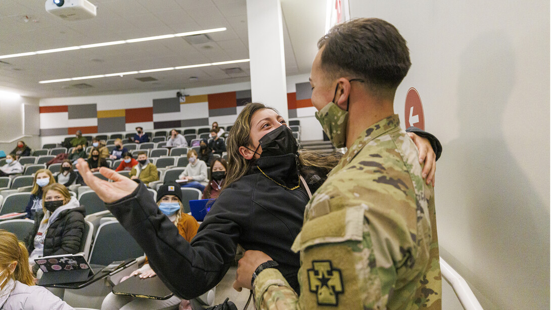 Spc. Allen Castaneda surprises his sister, Priscila, at the end of her criminal justice class. Castaneda returned early from his deployment with the Army Reserve.