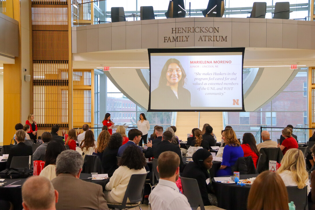 2022 Student Luminary recipient Marielena Moreno accepts her award during the reception in Hawks Hall.