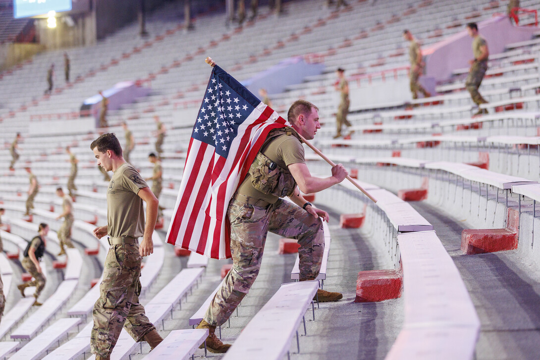 US Army Staff Sargeant Kyle Aldrich, a local recruiter, ran the steps carrying an American flag. More than 160 UNL ROTC cadets along with active duty military personnel, local first responders and UNO Air Force ROTC cadets ran 2200 steps in Memorial Stadium today. The run honors the first responders who ran up the 110 floors of the World Trade Centr on 9/11.