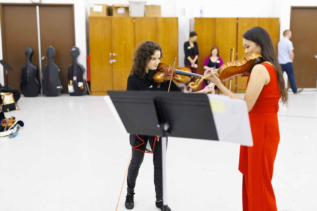 Violinist Sandy Cameron plays with Nadia Maudhoo during the master class. Master Classes for Hixson-Lied students given by musicians here for Danny Elfman week at the Lied. October 4, 2022.