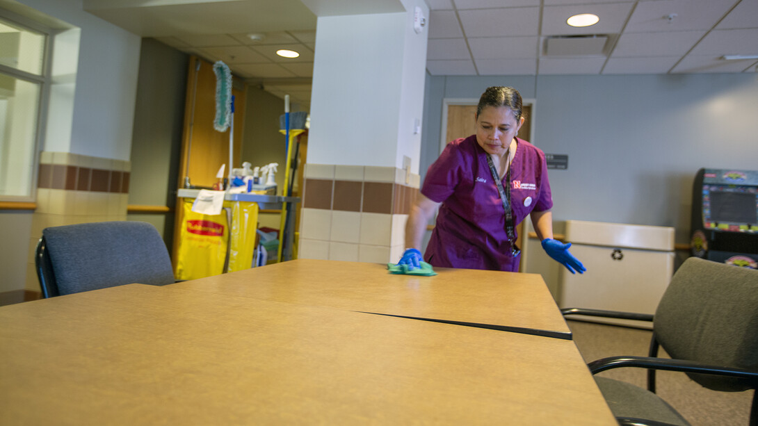 Saira Bautista de Preciado cleans a table in Kauffman Hall. Before coming to the United States in 1998, Bautista de Preciado worked as a middle school teacher in Guatemala. She taught literature and her favorite Spanish novel is “Carazamba.”