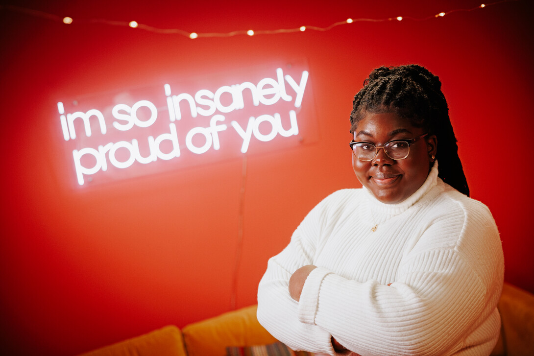 Odelia smiles for a photo in the College of Journalism's Experience Lab