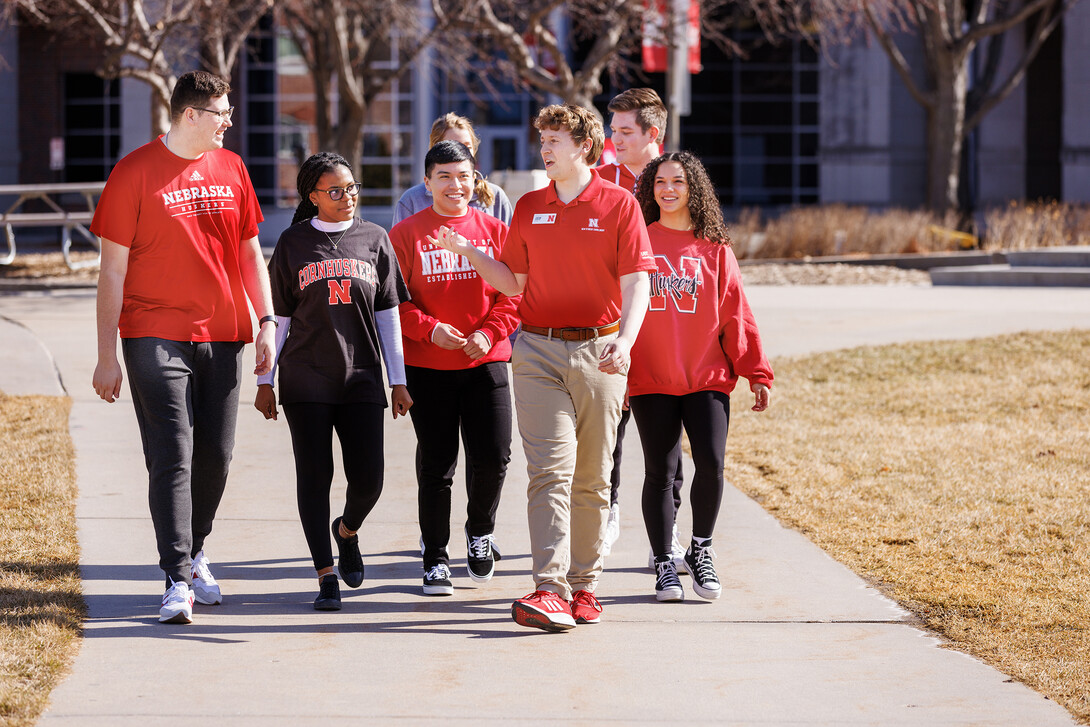 Prospective Huskers utilize a warmer February day to tour campus.