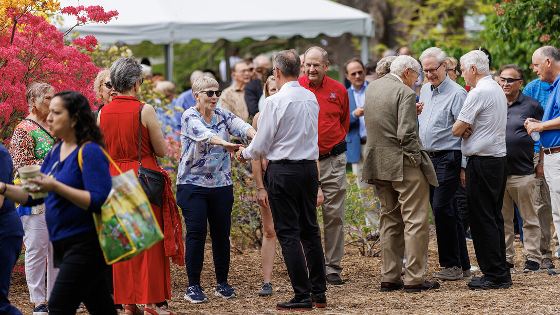 Maurenn Burson greets Chancellor Ronnie Green during the May 11 celebration. Burson is part of a group that traveled alongside the Greens during a mission trip to El Savador.