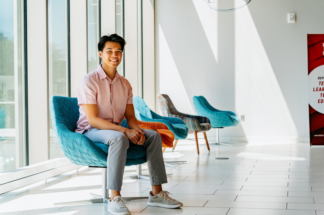 Photo by Jonah Tran // Andre smiles for a photo inside the Gwendolyn A. Newkirk Human Sciences Building