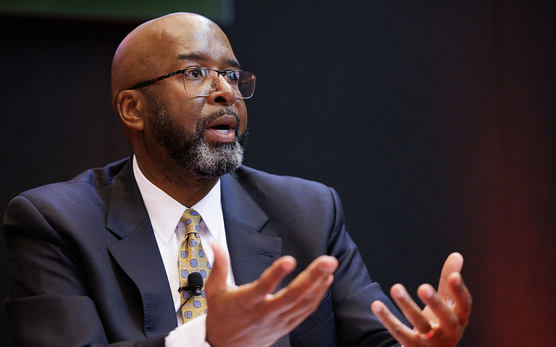 Rodney Bennett gestures as he answers a question during a public forum while on campus during the week of June 5.