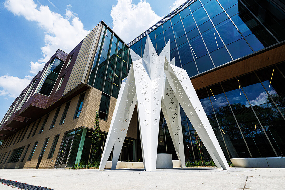 T.I.E. sculpture stands in front of Carolyn Pope Edwards Hall