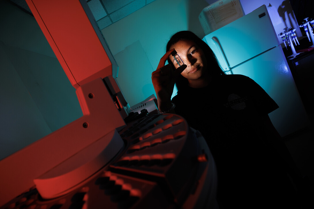 Anastasia Spruce looks through a vial for a gas chromatography mass spectrometrer in Filley Hall. Spruce, a senior in forensic science and and biochemistry, interned this summer with the Orange County (Florida) Sheriff Office.