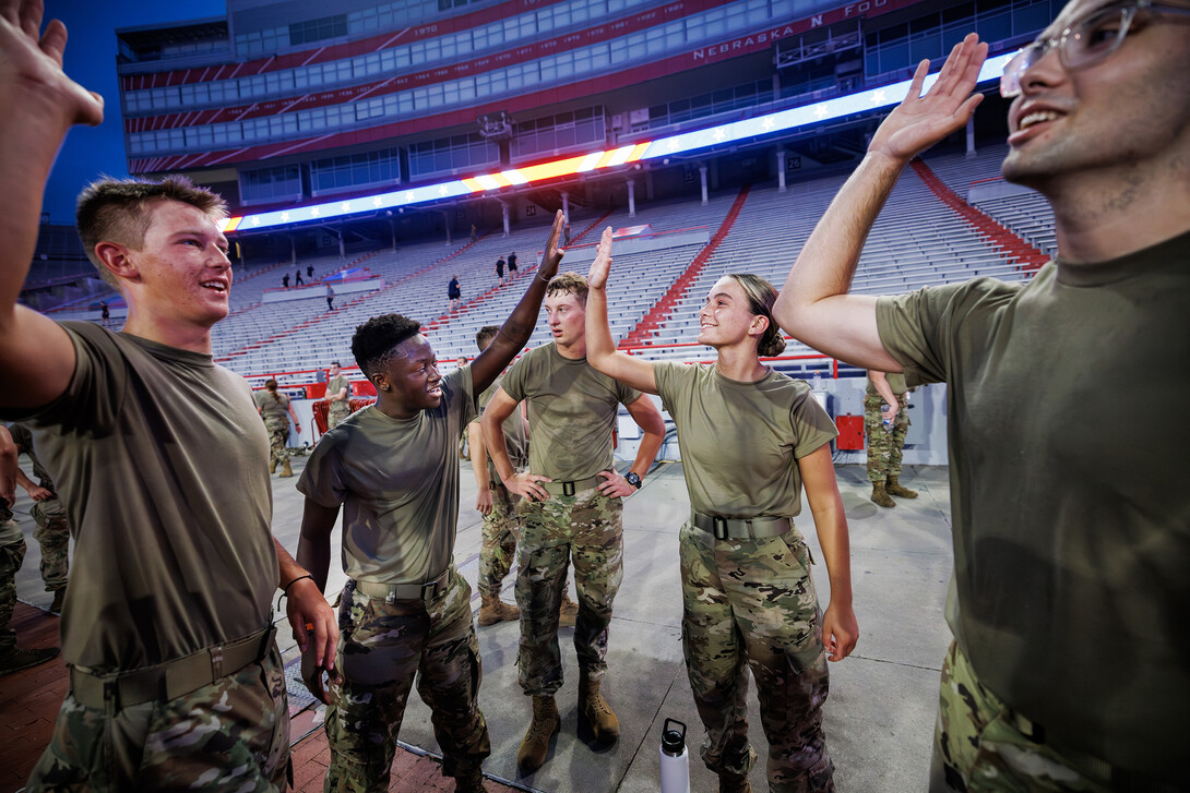 Five Eschleman, left, high fives malorie Mulligan following their stair climbs.