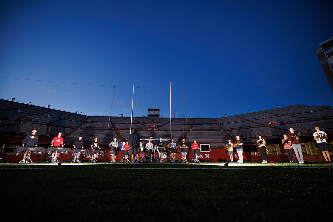 The drum line practices during their 6:30 a.m. sectional practice before the full band practice.