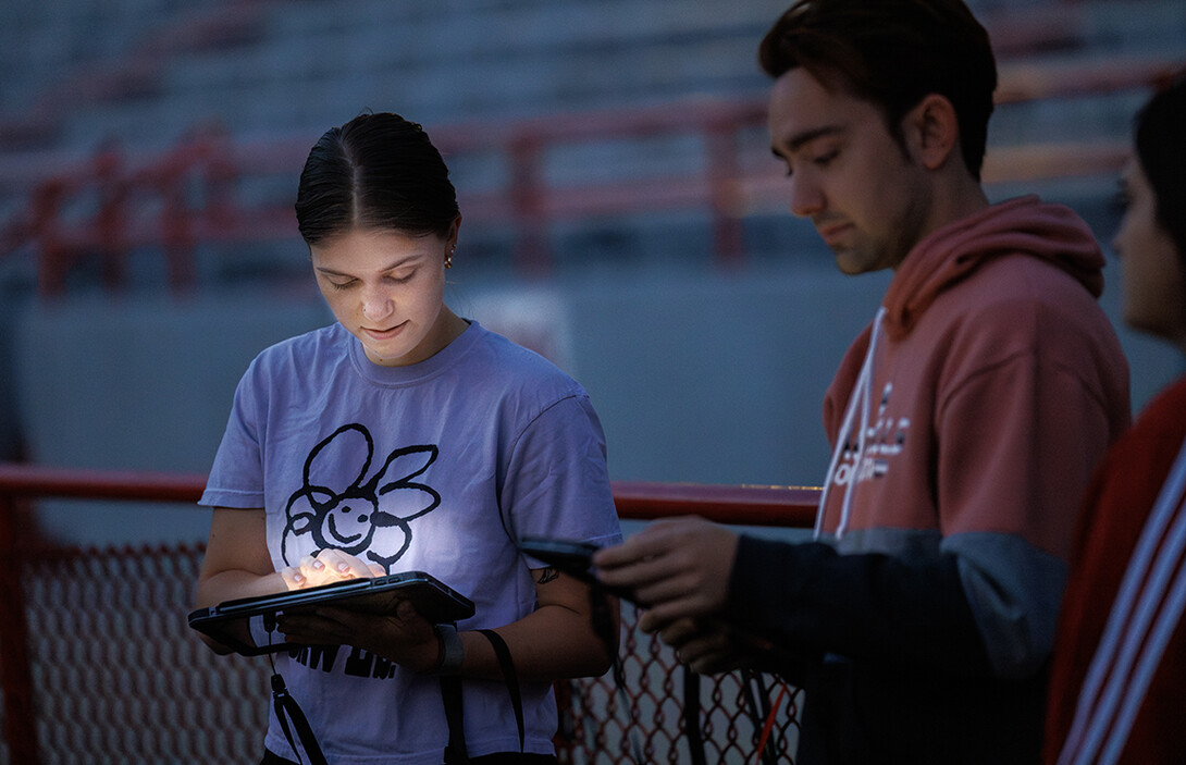 Vilynn Decker and the other drum majors go over their music before practice.