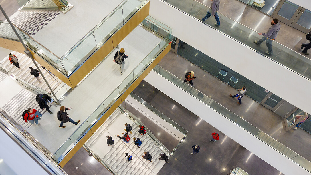 View looking down into Kiewit Hall, showing students going to class and moving through the various levels of the new building.