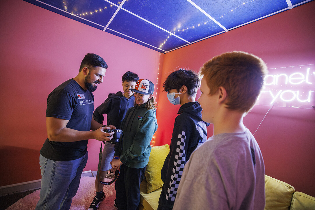 Alex Fernando leads a workshop for students from Lefler Middle School in Lincoln. Fernando and CoJMC ambassadors had the students taking photos, shooting video, social media posts and an advertising campaign.