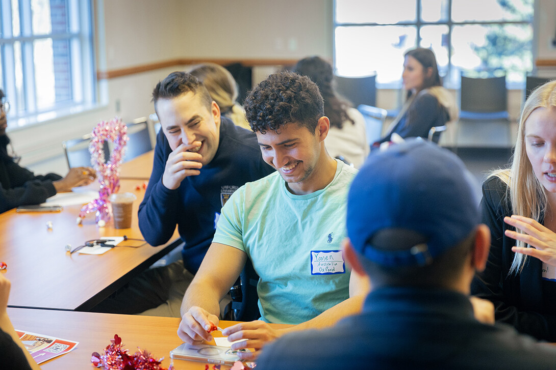 Yamen Seanwan (front) and Jay Mayberger laugh as they compare study abroad experiences.