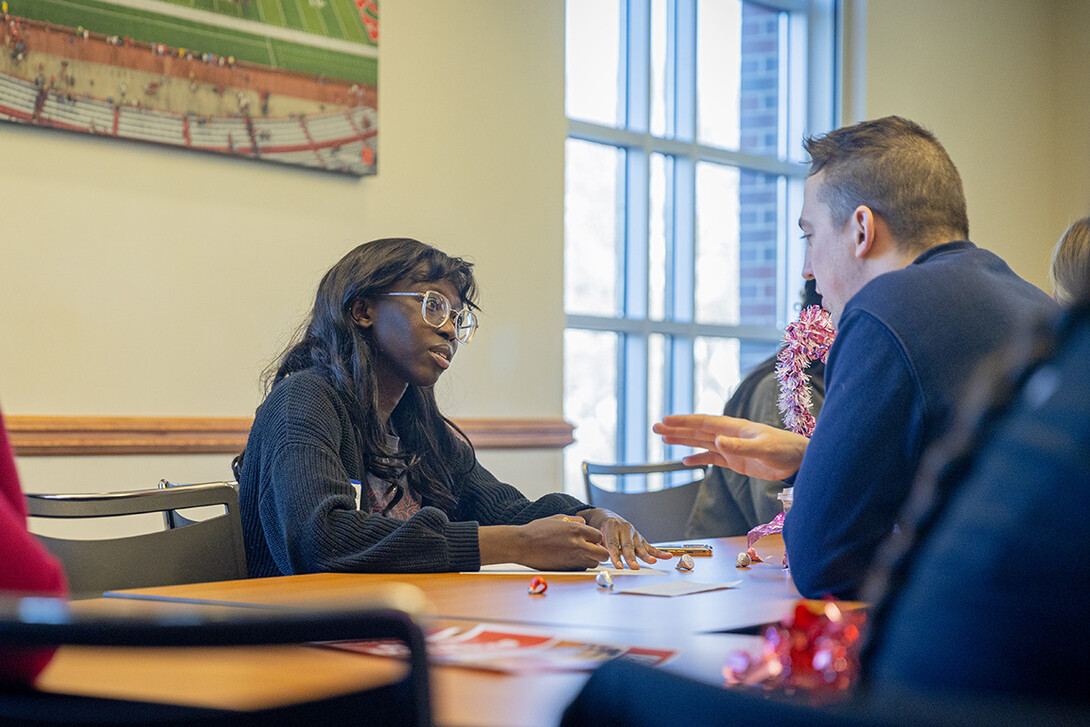 Minatallah Bi (left) asks Jay Mayberger about his education abroad experience during Global Experience Office's Study Abroad Speed Dating.