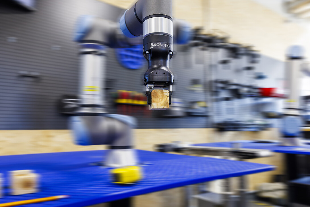 A robotic arm program stacks blocks at Nebraksa Innovation Studio.