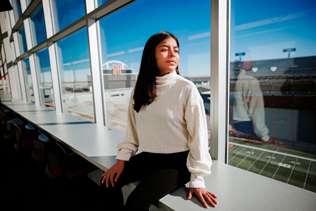 Photo Credit: Craig Chandler // Marissa Kraus looks across Tom Osborne Field from the media box in Memorial Stadium