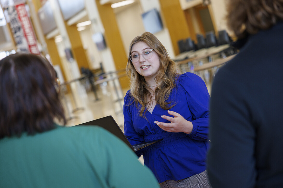 Addie Weiand, Business in Action Job Shadow program, now interning at Crete Carrier, talks with College of Business staff in Howard Hawks Hall.