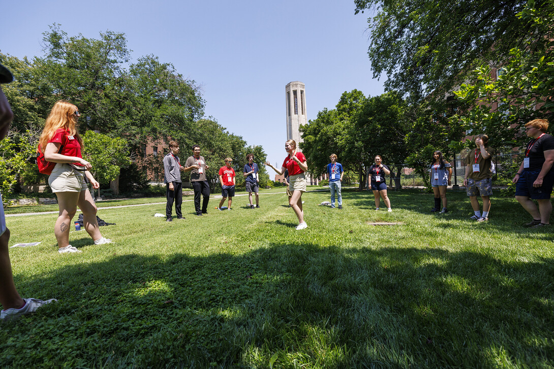 An NSE leader (center) leads a game for incoming Huskers July 15.