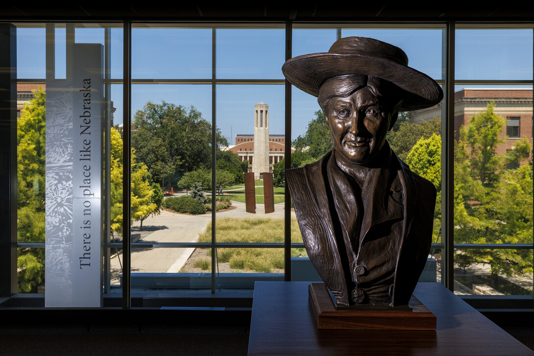 A bust of Willa Cather looks out over the Love Library North study area.  The bust is a first edition casting taken from the original sculpture by Littleton Alston that resides in Statuary Hall of the United States Capitol.