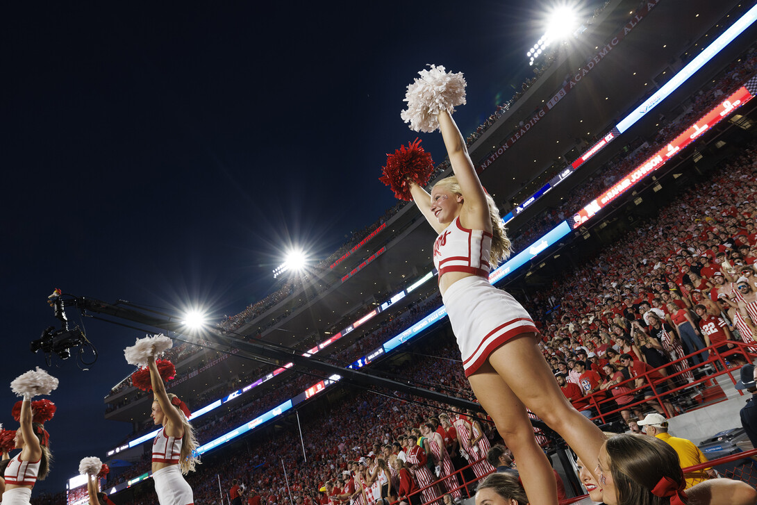 Cheerleaders perform at the football game against Illinois