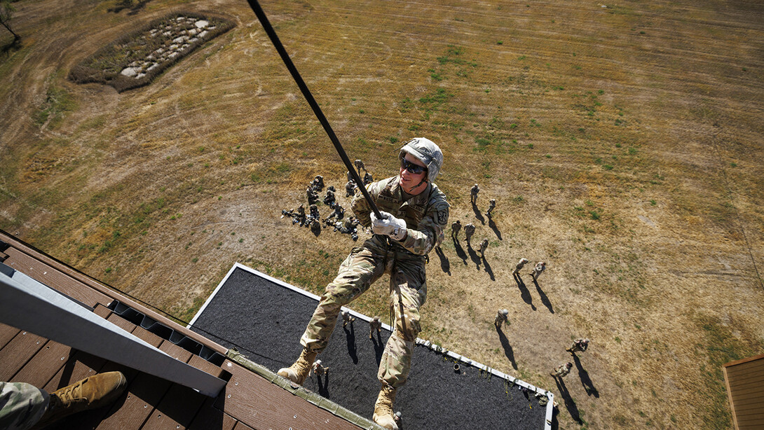 Cadet Joe Wiese, a sophomore criminology and criminal justice major, rappels down the tower at the Eastern Nebraska Research, Extension and Education Center near Mead.