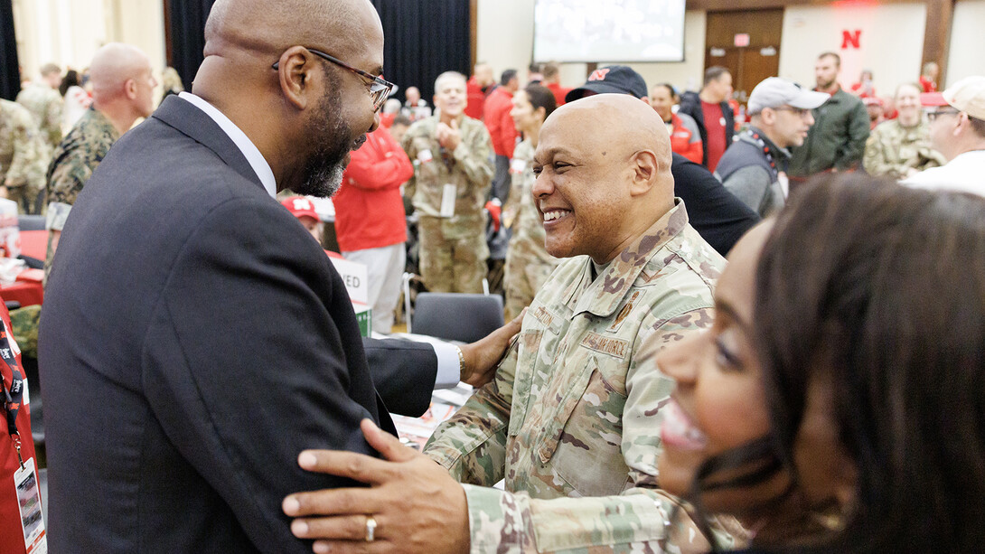 Chancellor Rodney D. Bennett shakes hands with four-star General Anthony J. Cotton during the pre-game celebration on Nov. 1. The event celebrated service members ahead of Veterans Day, which is Nov. 11.