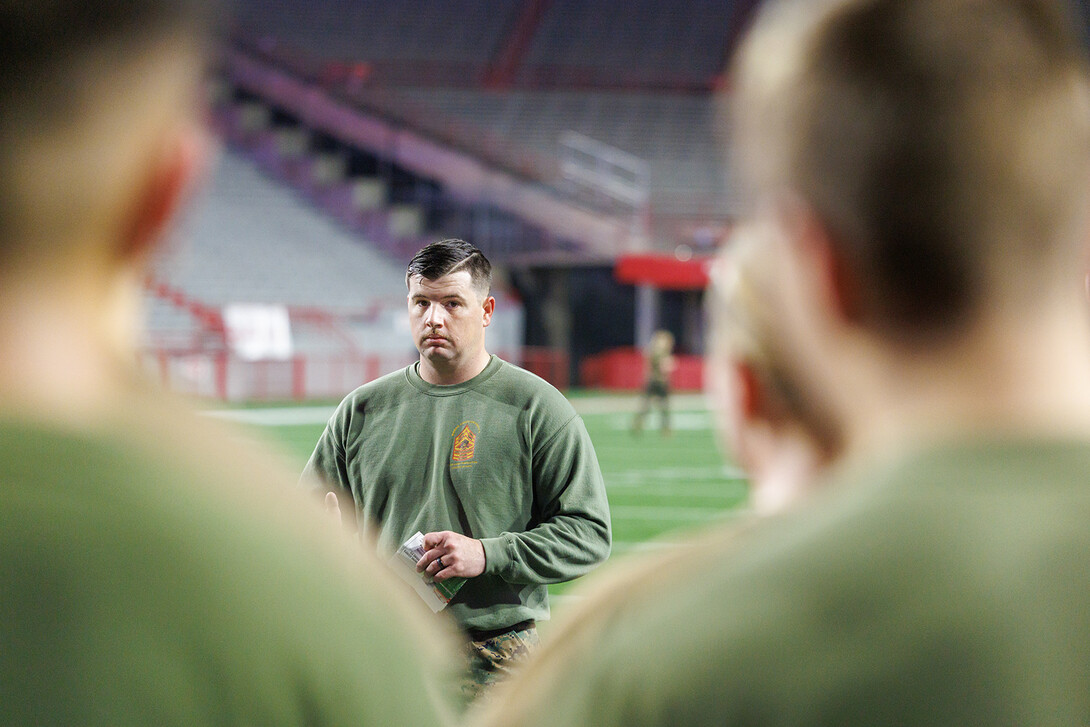 Staff Sergeant Dylon Taylor talks with cadets ahead of physical training on the morning of Nov. 8. Navy and Marine ROTC cadets participated in the training as part of an observance of the Marines' 149th anniversary, which was Nov. 10.