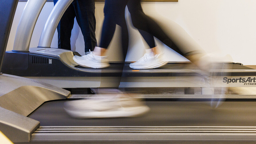 Feet are seen in motion on a treadmill
