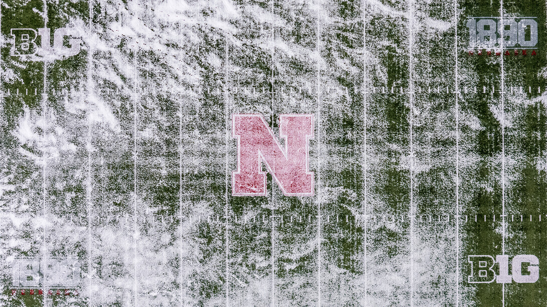 The iconic red "N" at the 50-yard line in Memorial Stadium burns bright through a thin layer of snow on Jan. 4.