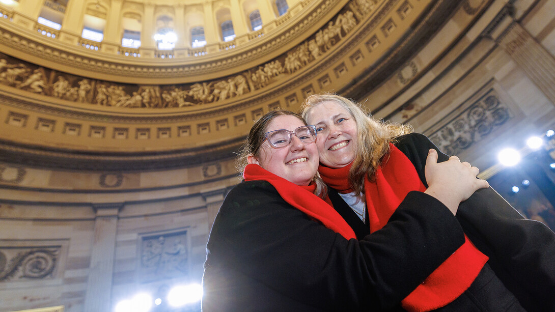 Analee Adams (left), a first-year secondary education major, hugs her grandmother, Ramiel Christensen, a senior vocal performance major, following a rehearsal inside the United States Capitol Rotunda on Jan. 19. The two performed with the university’s combined choir during the 60th Presidential Inauguration on Jan. 20.