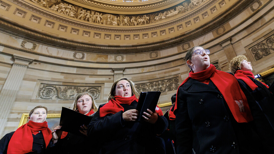 Analee Adams, right, freshman in secondary education, sings "One Voice" during the UNL Choirs’ rehearsal inside the United States Capitol rotunda.