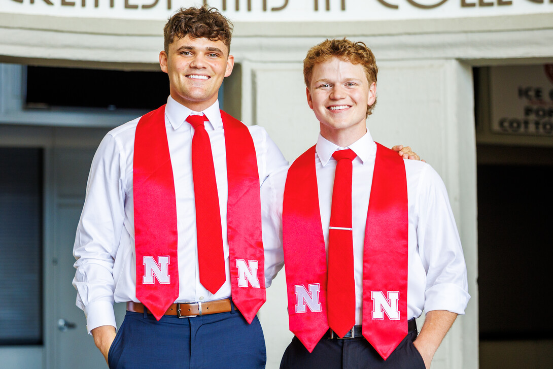 Ben Hastreiter or Brady Moylan reveal themselves as the students in the Herbie and Lil' Red mascot uniforms.