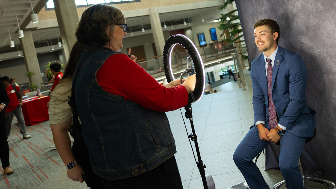 Student getting a professional headshot at a UNL career fair.