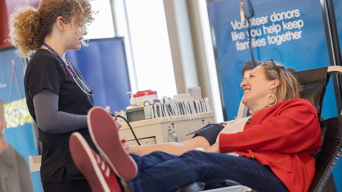 Jenni Puchalla, development and ticketing services manager in Husker Athletics, prepares to donate during the We Give Blood Drive in Memorial Stadium on Nov. 14.