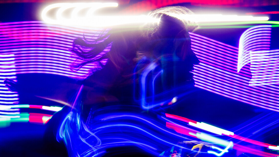 Bright patterns of light illuminate the outline of a student as they play Laser Tag in the Nebraska Union on Jan. 16.