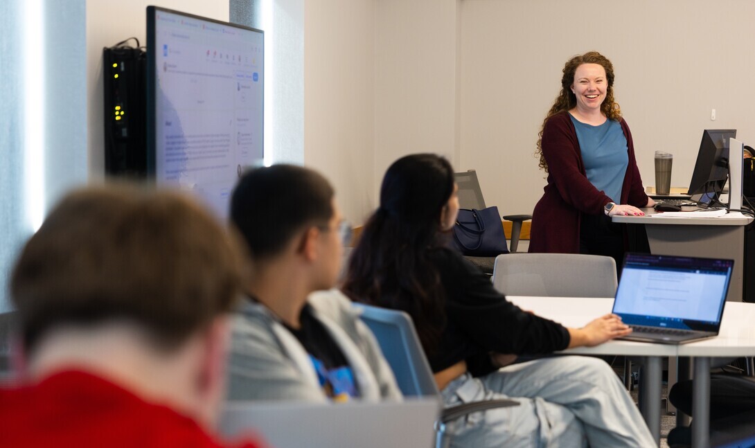 Allison Docter, one of the career coaches serving the College of Arts and Sciences, smiles while teaching during her class, "Career Ready, Life Ready." This is the first semester the class has been offered to seniors to help them prepare for life after college.