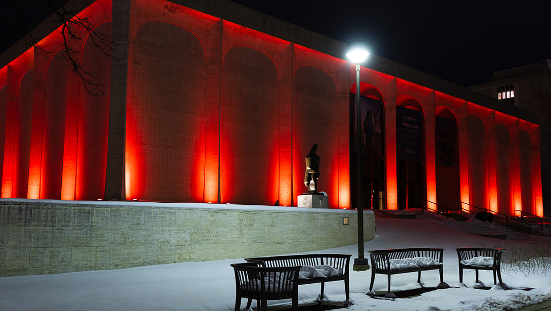 Sheldon Museum of Art is lit up in orange for Genoa Remembrance Day, Feb. 20.