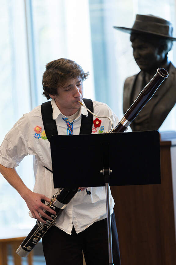 Comet Smith, a junior studying music composition, plays a bassoon solo written by Kathryn Hardgrave, a graduate student studying music composition. The composition was inspired by an item in the library's Archives and Special Collections – Hardgrave's item was a series of photographs of the Sand Hills by James Ducey.