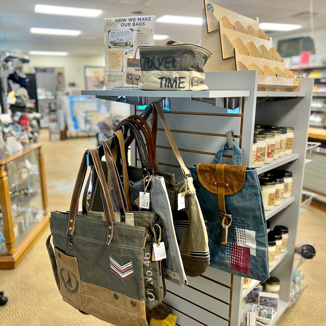 Travel bags and candles are among the offerings in the store.