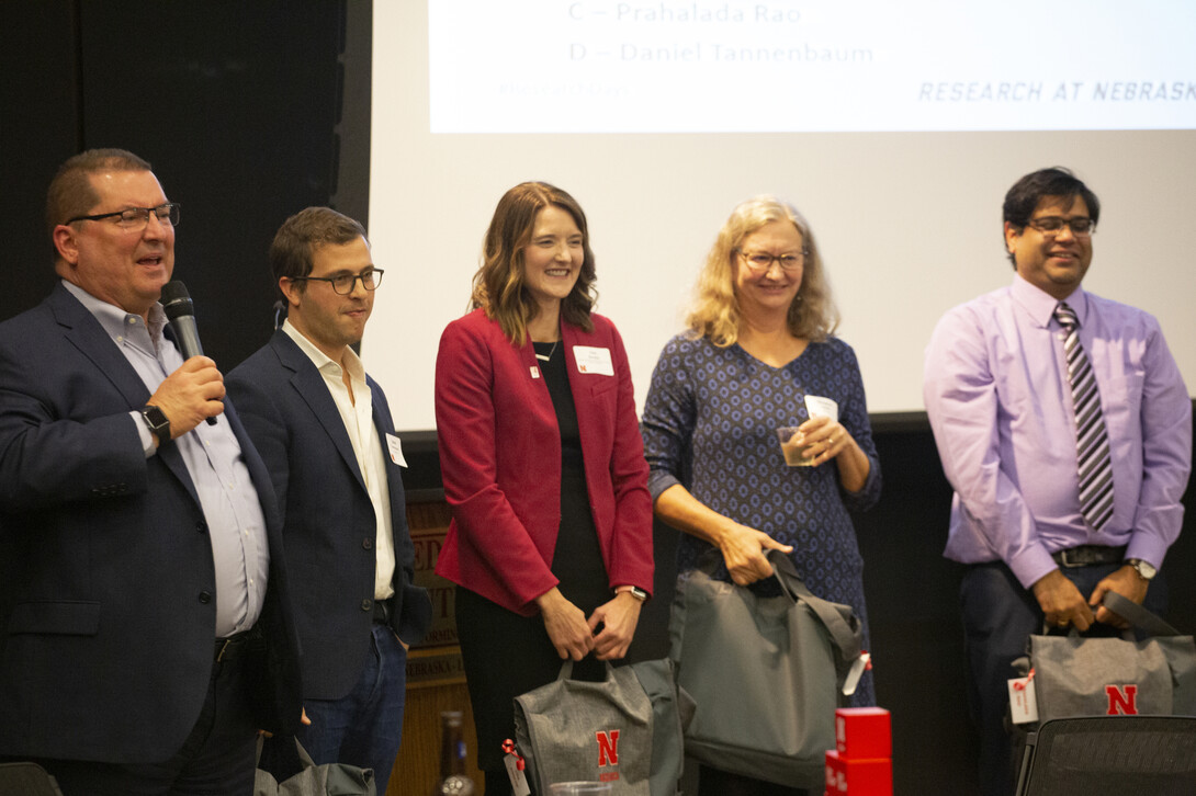 Bob Wilhelm, vice chancellor for the Office of Research and Economic Development, awaits the results of the Faculty Slam with participants Daniel Tennenbaum, Lisa Knoche, Margaret Jacobs and Prahalada Rao.