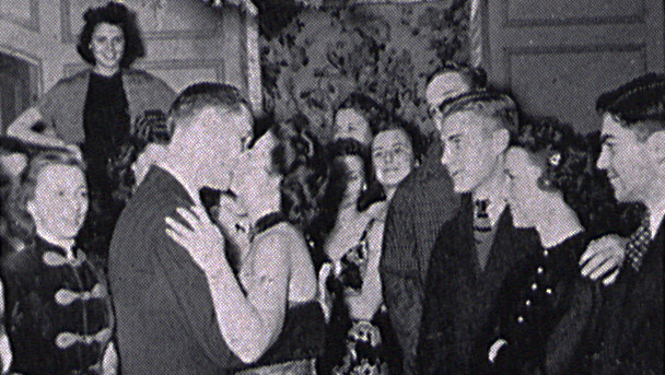 A couple kisses as students look on during the Delta Upsilon Christmas party in 1939. As part of its 50th anniversary, the University Archives and Special Collections is expanding its historic records from Recognized Student Organizations.