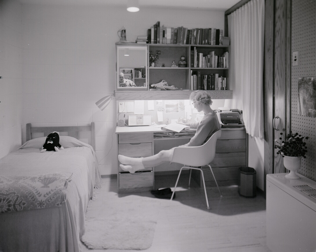 A student sits at a Cather-Pound desk in this photo taken shortly after the residence hall complex opened in 1963. The halls will be razed on Dec. 22.