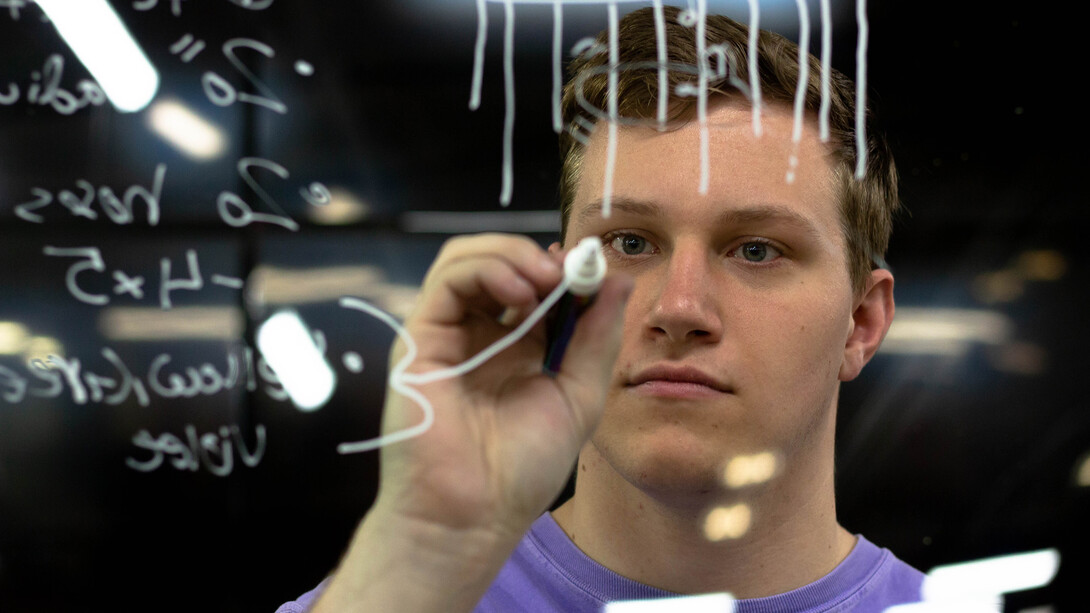 Brennan Sanders, a freshman mechanical engineering major, maps out the design for a hose toy that will allow giraffes to rub their ossicones (horn-like protuberances) against. Sanders was part of a team creating toys for giraffes coming to the Lincoln Children’s Zoo.