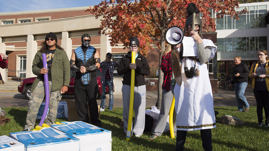 Dressed as Athena, Sarah Murray (with the bullhorn) outlines the rules of engagement prior to the start of the Oct. 31 reenactment of the Battle of Marathon.