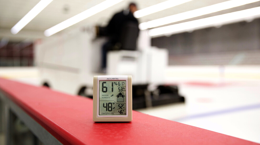 A monitor alongside the rink monitors air temperature and humidity inside UNL's John Breslow Ice Hockey Center. The facility features a system that balances temperature and humidity to improve the quality of the ice.