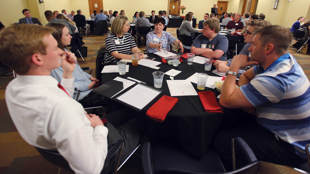 Ann Koopmann, an adviser with computer science and engineering, discusses an issue with members of the Greek and campus community during the Greek Vitality meeting on April 24.